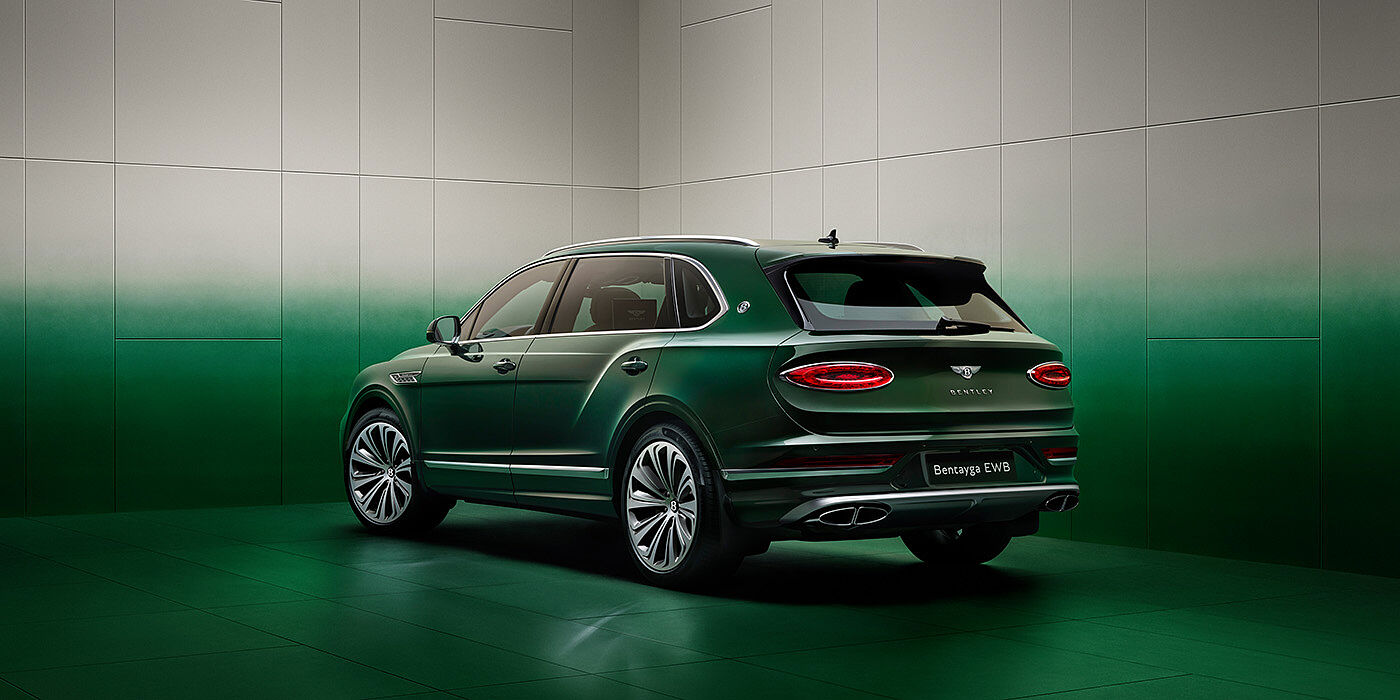 Bentley Phnom Penh Bentley Bentayga Extended Wheelbase SUV Rear three quarter view in Light Emerald green paint in green and grey room