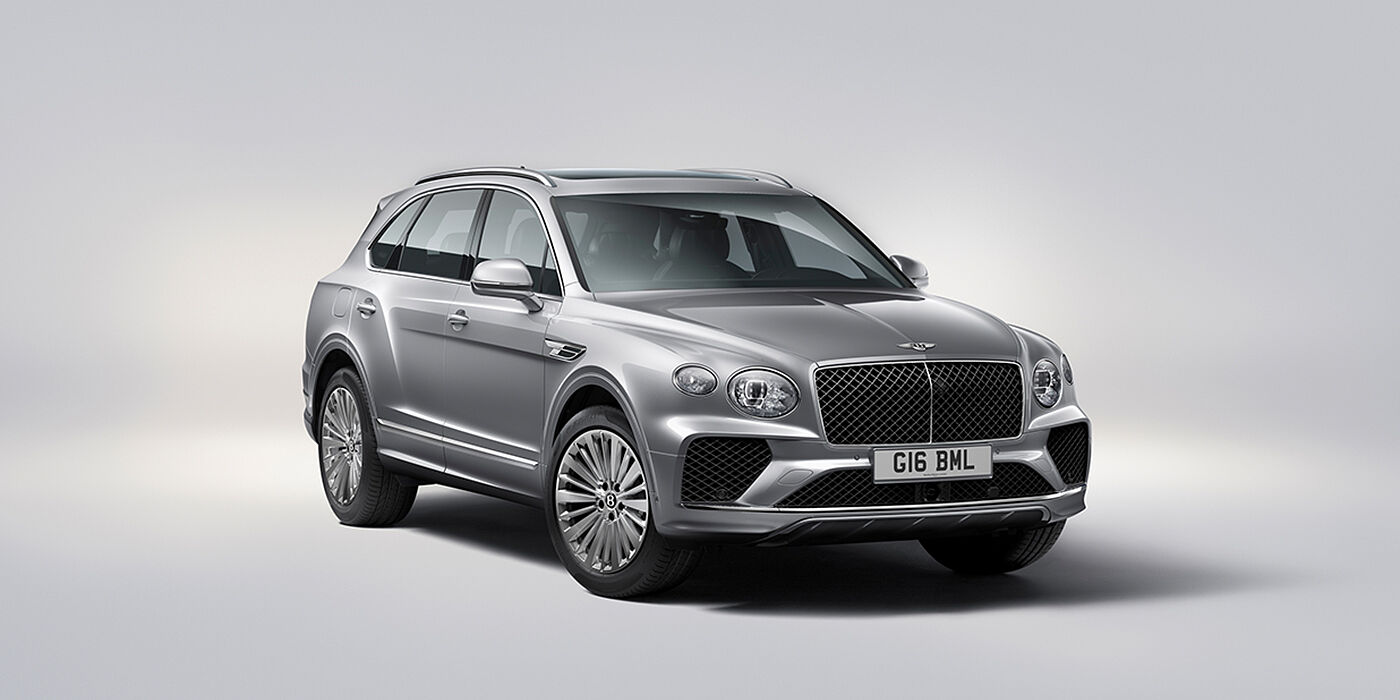 Bentley Phnom Penh Bentley Bentayga luxury SUV front three quarter view in Moonbeam paint with matrix grille and 21″ 5 spoke painted wheels