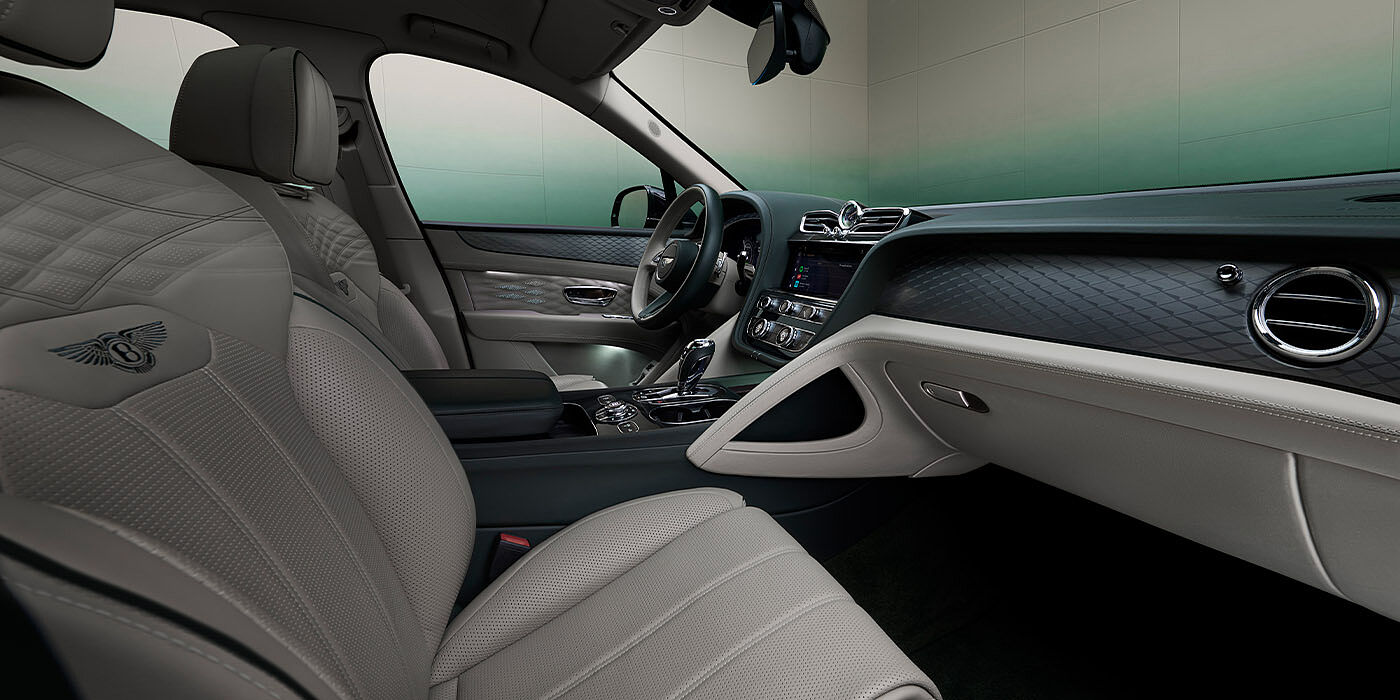 Bentley Phnom Penh Bentley Bentayga Extended Wheelbase Atelier Edition SUV front interior in Portland and Cumbrian Green hides with Dark Tint Diamond Brushed Aluminium veneer