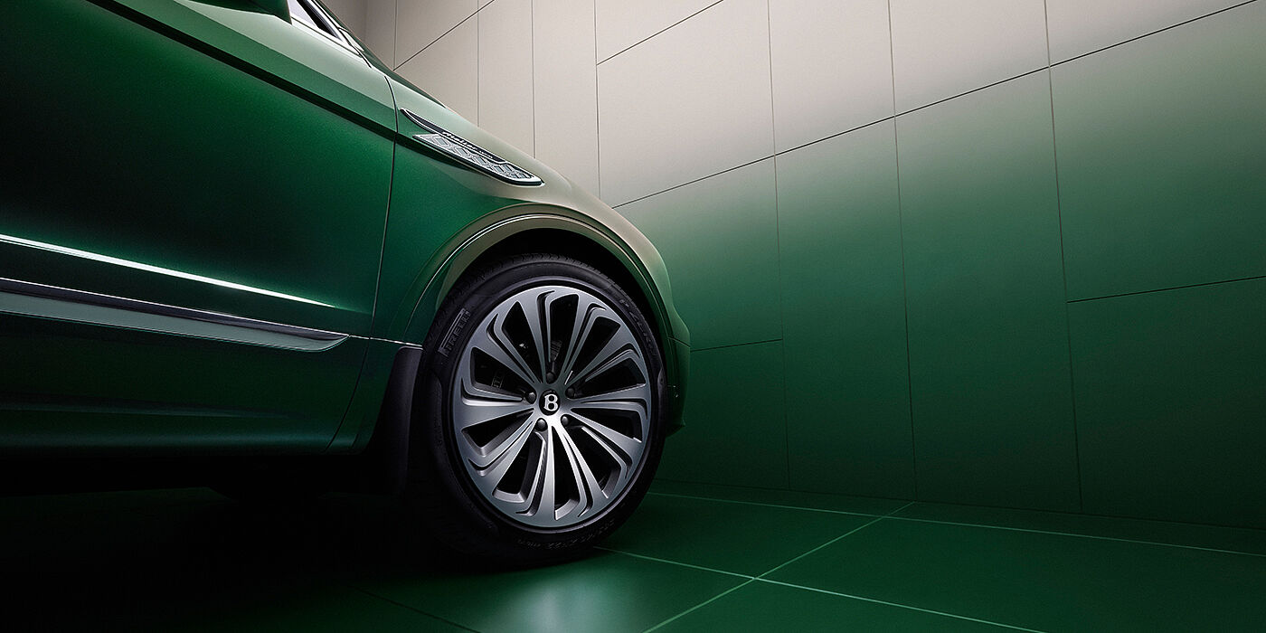 Bentley Phnom Penh Bentley Bentayga Extended Wheelbase Atelier Edition SUV in Light Emerald green paint front side detail with 22 inch 10 spoke wheel