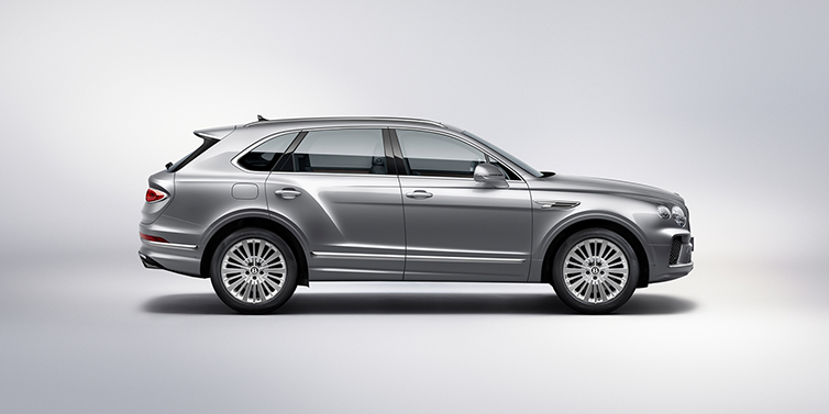 Bentley Phnom Penh Bentley Bentayga SUV side profile in Moonbeam silver paint against white background featuring 21 inch 5 spoke wheels